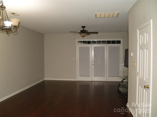 11107 Lions Mane St, Charlotte, NC 28273 - empty room featuring a chandelier, dark wood-style floors, a ceiling fan, and french doors