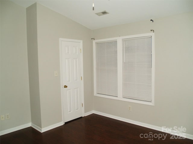 11107 Lions Mane St, Charlotte, NC 28273 - spare room with dark wood finished floors, baseboards, and vaulted ceiling