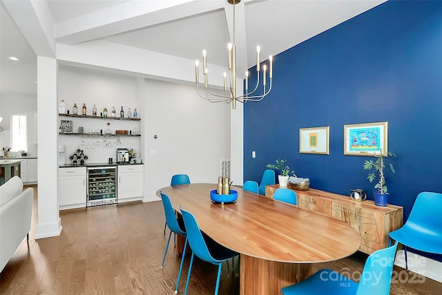 2600 Palm Ave, Charlotte, NC 28205 - dining space with wine cooler, bar area, dark wood-style floors, a chandelier, and recessed lighting