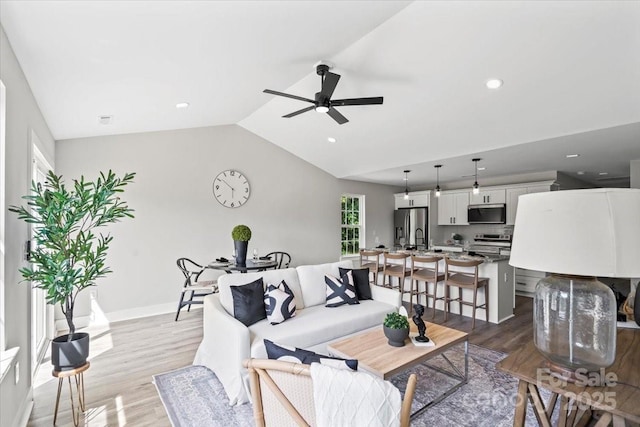 2906 Swicegood Rd, Linwood, NC 27299 - living room with wood finished floors, ceiling fan, vaulted ceiling, recessed lighting, and baseboards