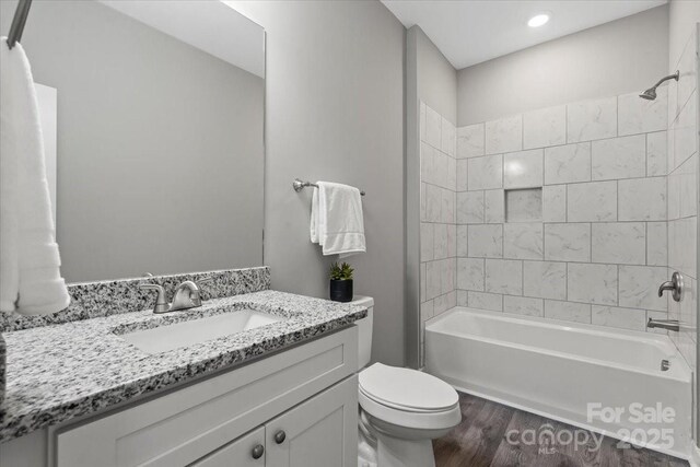 213 E Division Ave, East Spencer, NC 28039 - full bath featuring toilet, vanity, wood finished floors, and shower / bath combination