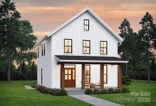 0000 Trull Hinson Rd Unit 4, Wingate, NC 28174 - modern farmhouse featuring a front yard and board and batten siding