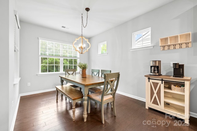 12637 Belmont Mansion Dr, Charlotte, NC 28273 - dining room featuring a chandelier, baseboards, and dark wood-type flooring