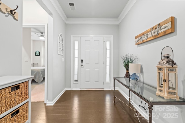 12637 Belmont Mansion Dr, Charlotte, NC 28273 - foyer with ornamental molding, ceiling fan, dark wood-style flooring, and baseboards