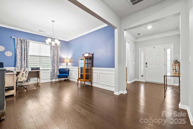 12637 Belmont Mansion Dr, Charlotte, NC 28273 - entryway with wood finished floors, ornamental molding, a chandelier, and wainscoting