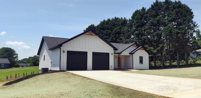 4364 Grover Pl, Granite Falls, NC 28630 - modern farmhouse style home featuring driveway, a garage, a front lawn, board and batten siding, and roof with shingles