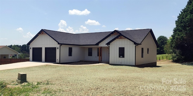 4364 Grover Pl, Granite Falls, NC 28630 - modern farmhouse featuring board and batten siding, concrete driveway, a garage, and a shingled roof