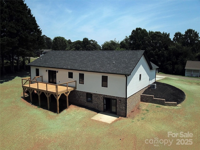 4364 Grover Pl, Granite Falls, NC 28630 - rear view of property featuring a lawn, a deck, brick siding, and a shingled roof