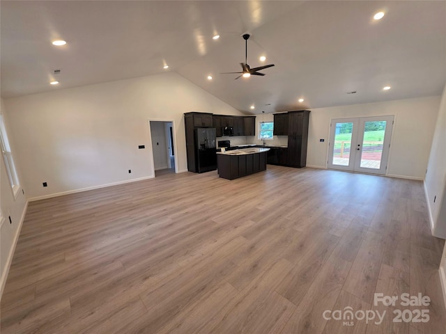 4364 Grover Pl, Granite Falls, NC 28630 - kitchen featuring open floor plan, black fridge with ice dispenser, a kitchen island, a ceiling fan, and light wood-style floors