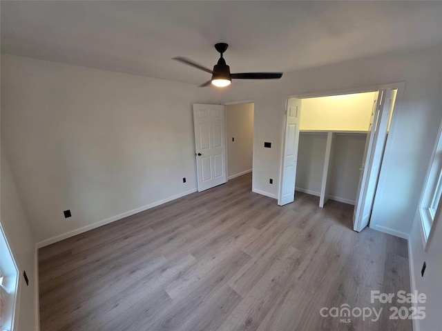 4364 Grover Pl, Granite Falls, NC 28630 - unfurnished bedroom featuring wood finished floors, ceiling fan, and a closet