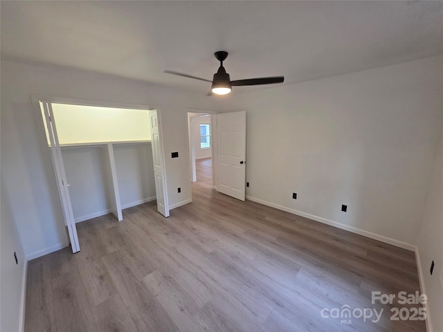 4364 Grover Pl, Granite Falls, NC 28630 - unfurnished bedroom featuring wood finished floors, a ceiling fan, and a closet