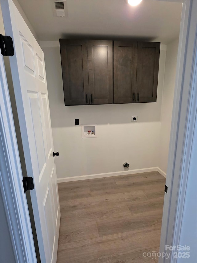 4364 Grover Pl, Granite Falls, NC 28630 - laundry room featuring washer hookup, cabinet space, wood finished floors, and hookup for an electric dryer