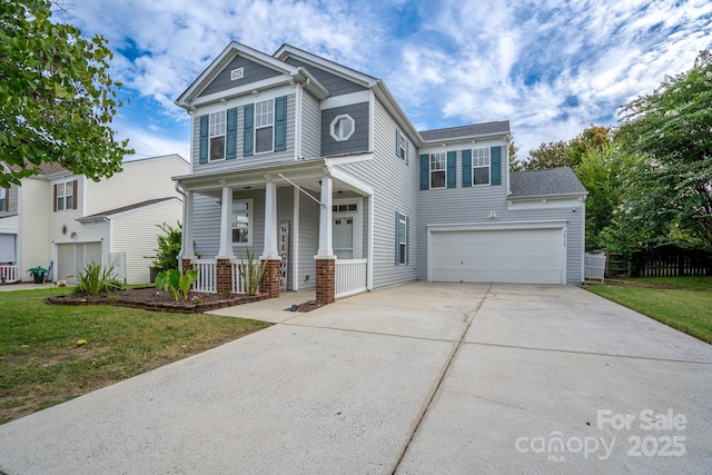 12719 Walking Stick Dr, Charlotte, NC 28278 - view of front of house featuring covered porch, driveway, a front yard, and an attached garage
