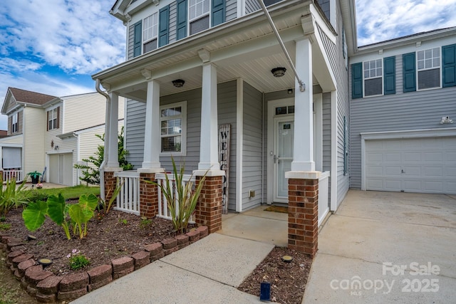 12719 Walking Stick Dr, Charlotte, NC 28278 - property entrance with a porch, an attached garage, and driveway