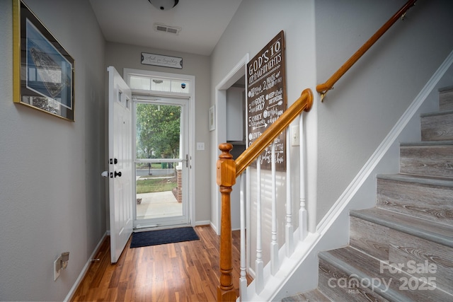 12719 Walking Stick Dr, Charlotte, NC 28278 - entrance foyer featuring stairway, wood finished floors, and baseboards