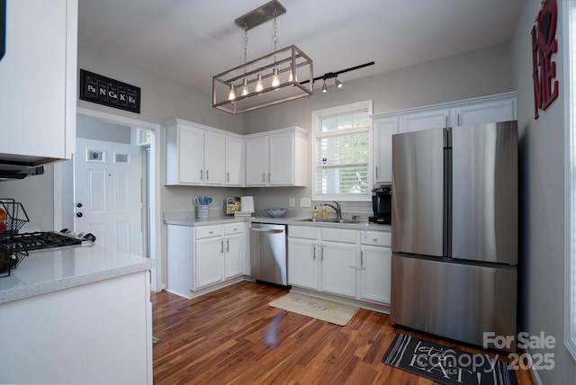 12719 Walking Stick Dr, Charlotte, NC 28278 - kitchen featuring stainless steel appliances, a sink, white cabinets, dark wood-type flooring, and light countertops