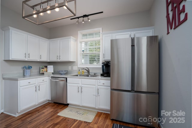 12719 Walking Stick Dr, Charlotte, NC 28278 - kitchen with stainless steel appliances, a sink, dark wood finished floors, and light countertops