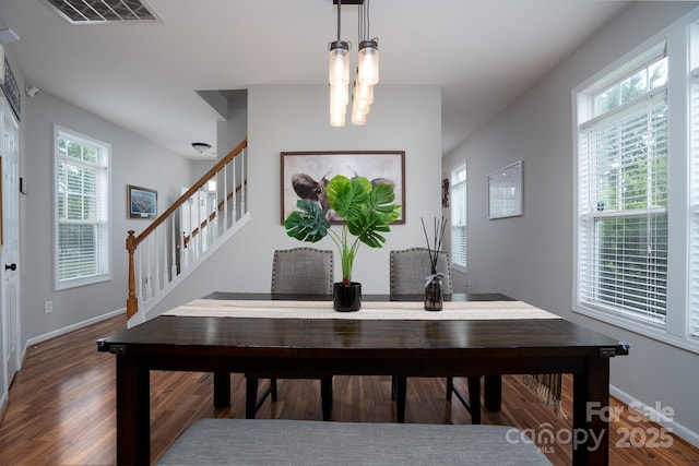 12719 Walking Stick Dr, Charlotte, NC 28278 - dining room with wood finished floors, baseboards, and stairs