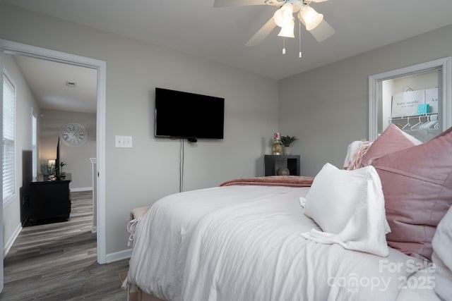 12719 Walking Stick Dr, Charlotte, NC 28278 - bedroom with wood finished floors, baseboards, and a ceiling fan