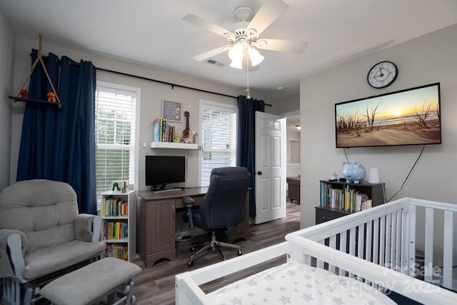 12719 Walking Stick Dr, Charlotte, NC 28278 - bedroom with wood finished floors, an office area, ceiling fan, and a crib