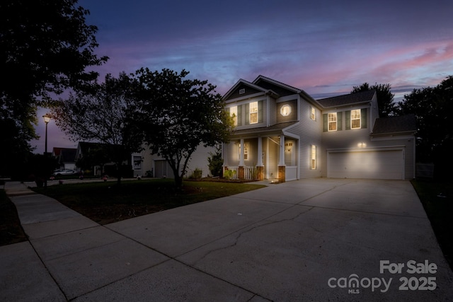 12719 Walking Stick Dr, Charlotte, NC 28278 - view of front of home with covered porch, driveway, an attached garage, and a front yard