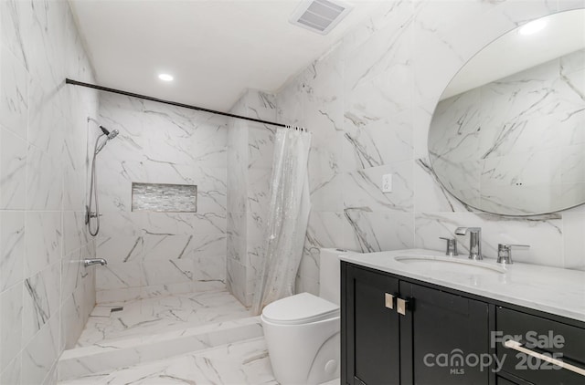 8429 Meadowcroft Ct, Charlotte, NC 28215 - bathroom with vanity, toilet, a marble finish shower, tile walls, and marble finish flooring