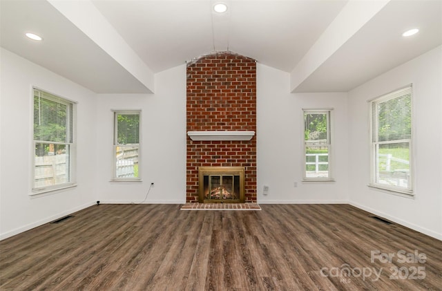 8429 Meadowcroft Ct, Charlotte, NC 28215 - unfurnished living room featuring lofted ceiling, wood finished floors, baseboards, a brick fireplace, and recessed lighting