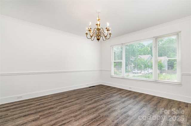 8429 Meadowcroft Ct, Charlotte, NC 28215 - spare room featuring a chandelier, dark wood-type flooring, ornamental molding, and baseboards
