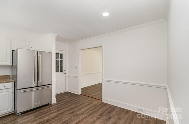 8429 Meadowcroft Ct, Charlotte, NC 28215 - kitchen with high quality fridge, white cabinetry, ornamental molding, dark wood finished floors, and recessed lighting