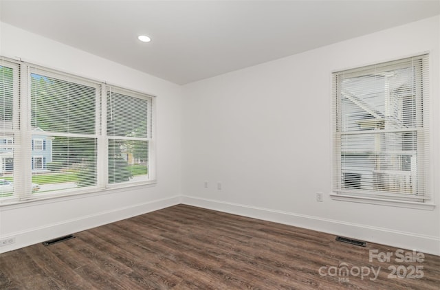 8429 Meadowcroft Ct, Charlotte, NC 28215 - spare room featuring baseboards, dark wood-style floors, and recessed lighting