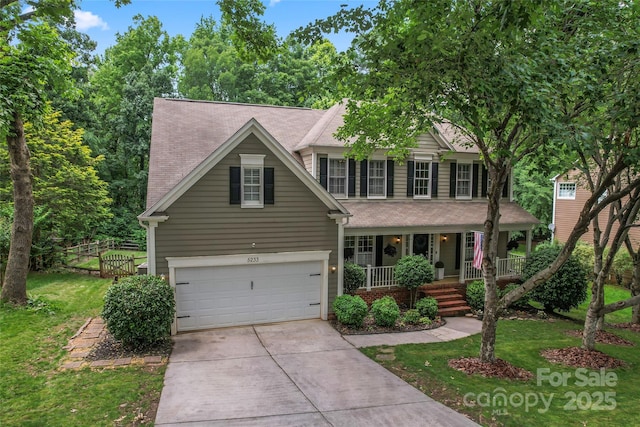 5233 Fairvista Dr, Charlotte, NC 28269 - view of front facade with a porch, driveway, and an attached garage