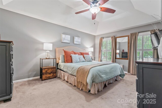 5233 Fairvista Dr, Charlotte, NC 28269 - bedroom with multiple windows, light colored carpet, baseboards, and a raised ceiling