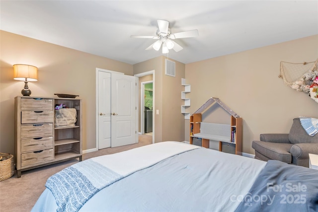 5233 Fairvista Dr, Charlotte, NC 28269 - bedroom featuring light colored carpet, washer / clothes dryer, a ceiling fan, and baseboards