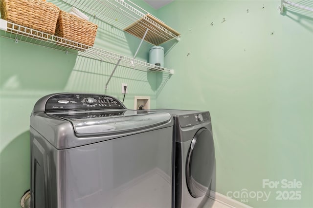 5233 Fairvista Dr, Charlotte, NC 28269 - laundry room with independent washer and dryer and baseboards