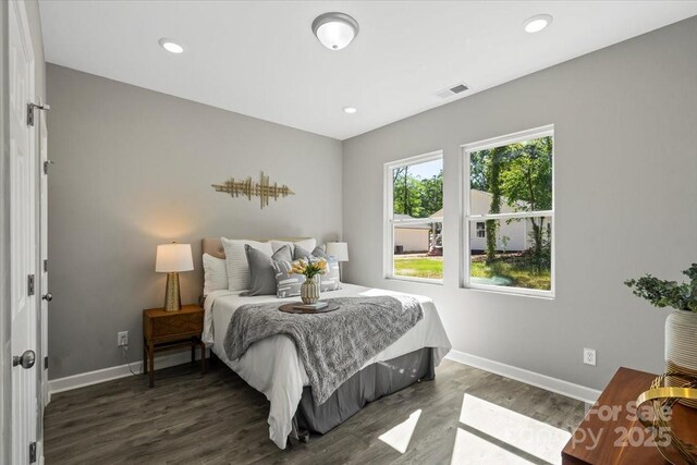 217 E Division Ave, East Spencer, NC 28039 - bedroom featuring baseboards, wood finished floors, and recessed lighting