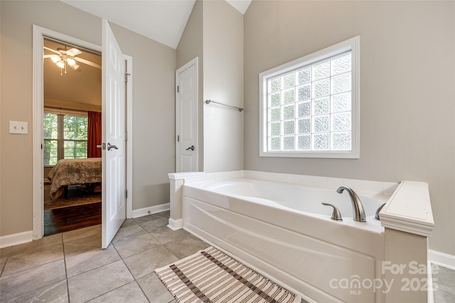 1648 Jonesberry Dr, Rock Hill, SC 29732 - ensuite bathroom with a bath, baseboards, lofted ceiling, and tile patterned flooring