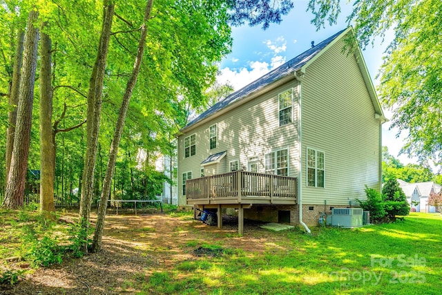 1648 Jonesberry Dr, Rock Hill, SC 29732 - back of house featuring a trampoline, a wooden deck, a yard, central AC unit, and crawl space