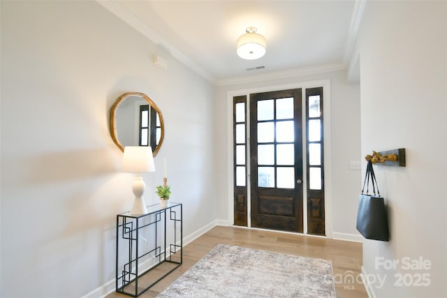 3924 Dahlia Dr, Harrisburg, NC 28075 - entryway with crown molding, baseboards, and wood finished floors