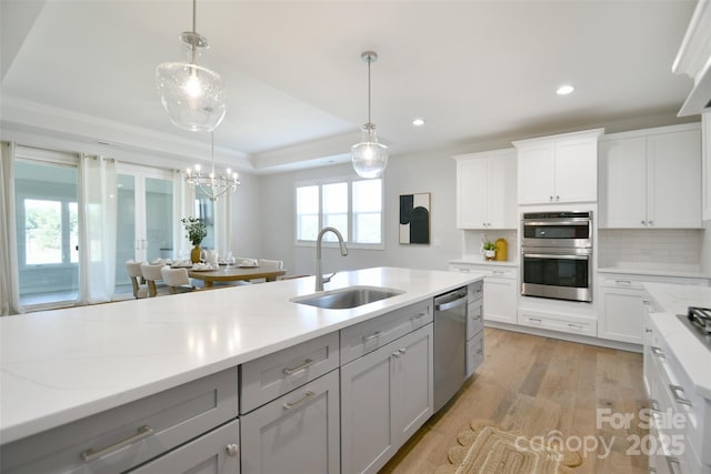 3924 Dahlia Dr, Harrisburg, NC 28075 - kitchen featuring a sink, gray cabinetry, stainless steel appliances, tasteful backsplash, and recessed lighting