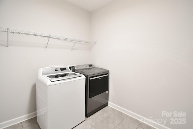 3924 Dahlia Dr, Harrisburg, NC 28075 - laundry area featuring washer and dryer, baseboards, and light tile patterned floors