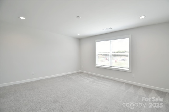 3924 Dahlia Dr, Harrisburg, NC 28075 - empty room featuring baseboards, recessed lighting, and light colored carpet