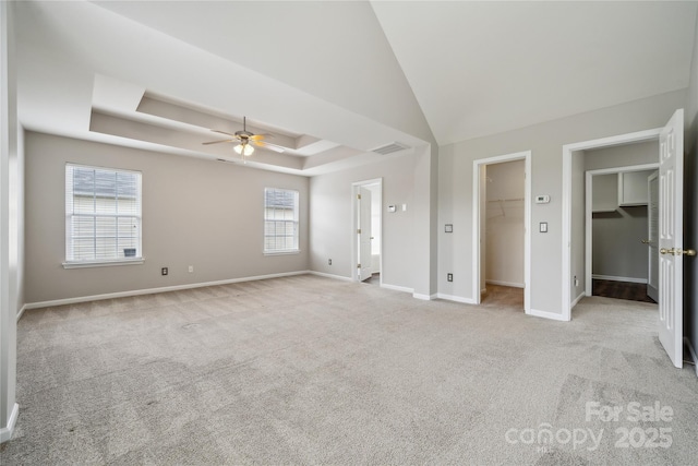 2028 Covered Bridge Ct, Rock Hill, SC 29732 - unfurnished bedroom with a walk in closet, a raised ceiling, carpet, and baseboards