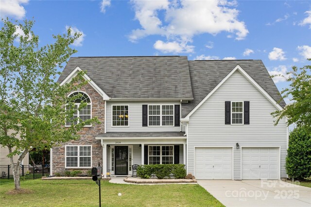 2028 Covered Bridge Ct, Rock Hill, SC 29732 - traditional-style house featuring stone siding, concrete driveway, a garage, and a shingled roof