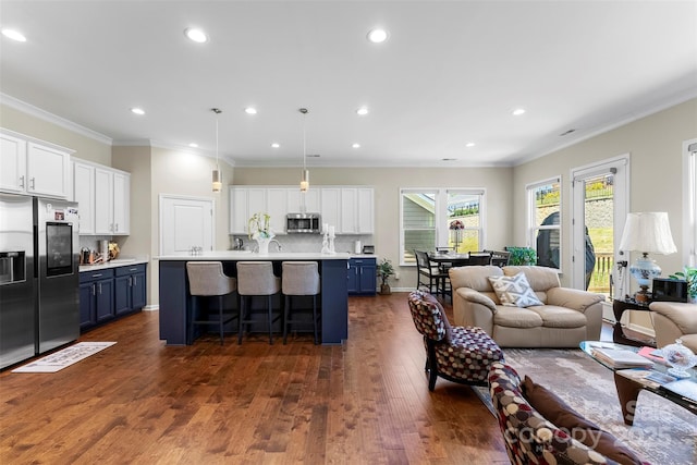 19004 Dry Narrows Way, Charlotte, NC 28278 - living area featuring dark wood-type flooring, ornamental molding, and recessed lighting