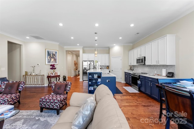 19004 Dry Narrows Way, Charlotte, NC 28278 - living area featuring ornamental molding, light wood finished floors, and recessed lighting