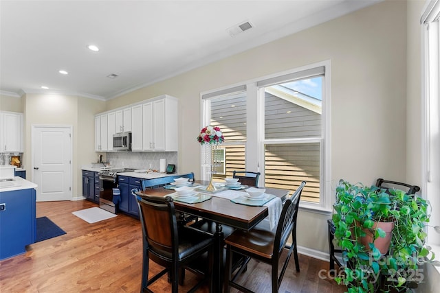 19004 Dry Narrows Way, Charlotte, NC 28278 - dining area featuring ornamental molding, light wood-type flooring, and recessed lighting