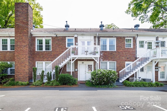 524 Hawthorne Ln, Charlotte, NC 28204 - view of property with stairway and cooling unit