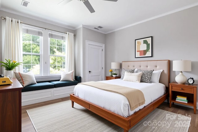 524 Hawthorne Ln, Charlotte, NC 28204 - bedroom featuring wood finished floors, crown molding, and a ceiling fan