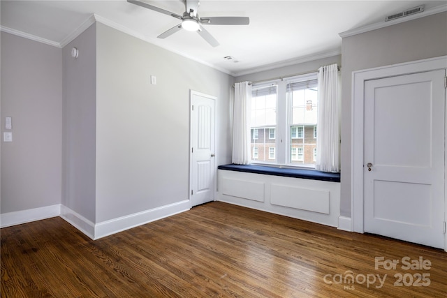 524 Hawthorne Ln, Charlotte, NC 28204 - unfurnished bedroom with crown molding, dark wood-style flooring, baseboards, and ceiling fan
