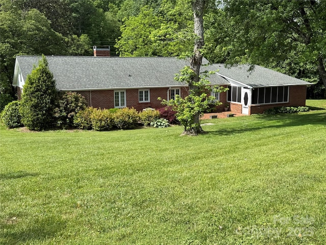 3586 US-70 Rd W, Marion, NC 28752 - back of property with brick siding, a lawn, roof with shingles, and a chimney
